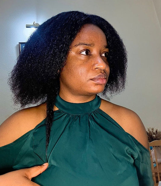 An image of Bethy showing off her natural hair